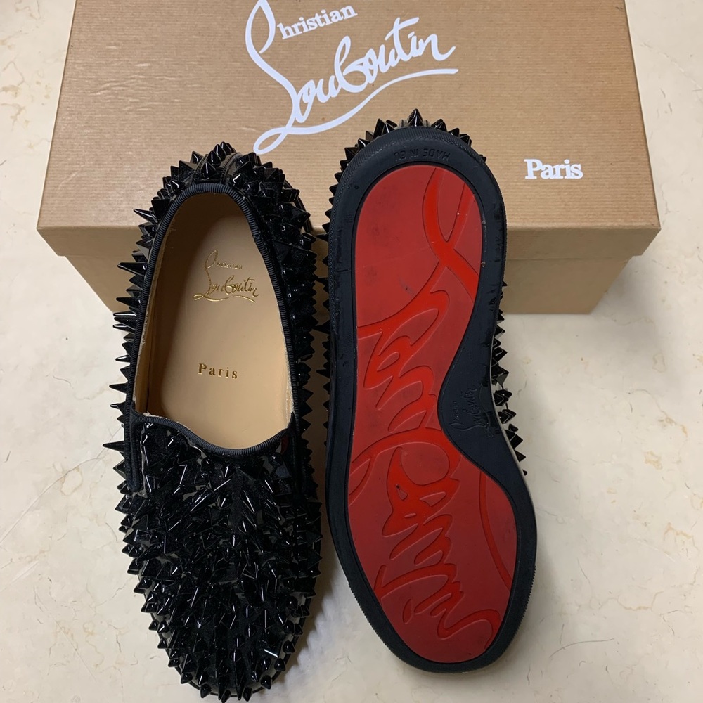 Christian Louboutin Black Spiked Slip-Ons with Red Sole